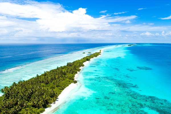 Tropical beach and turquoise lagoon at Cocos (Keeling) Islands, Indian Ocean